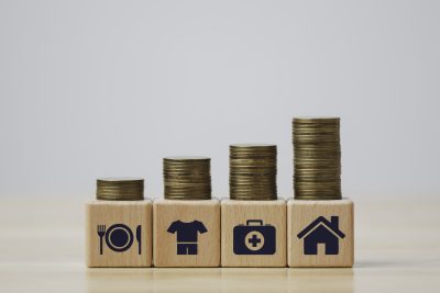 Step of coins stacks growing with food, clothes, house, 3 necessities that humans have to pay for living,