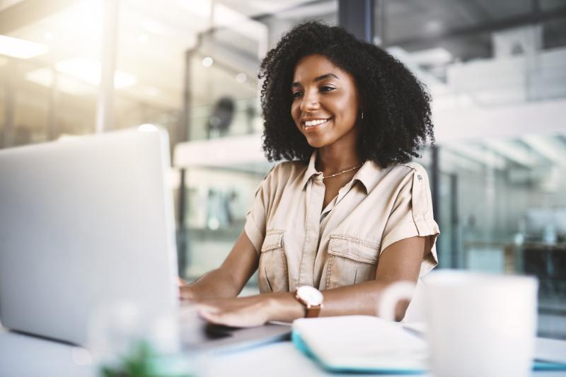 Woman at laptop computer in office